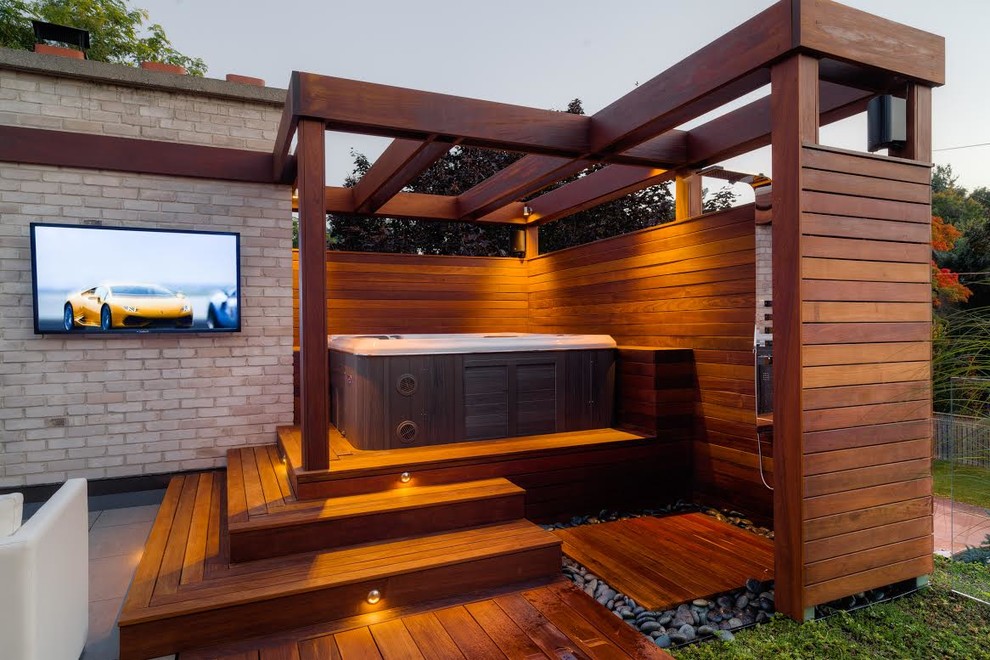 Design ideas for a patio in Toronto with an outdoor shower, decking and a pergola.