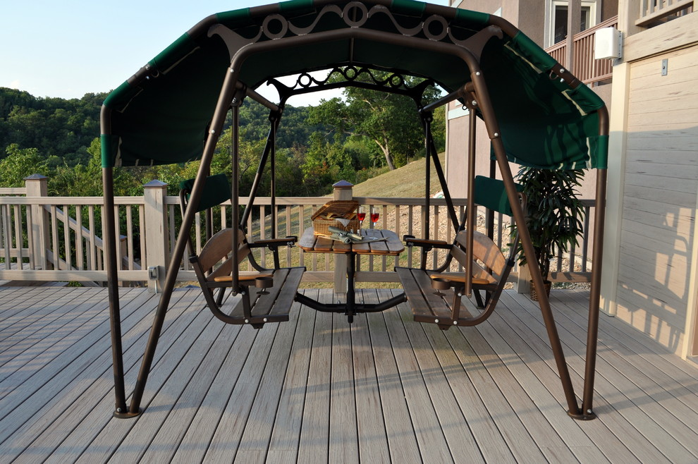 Deck - mid-sized transitional backyard deck idea with a roof extension