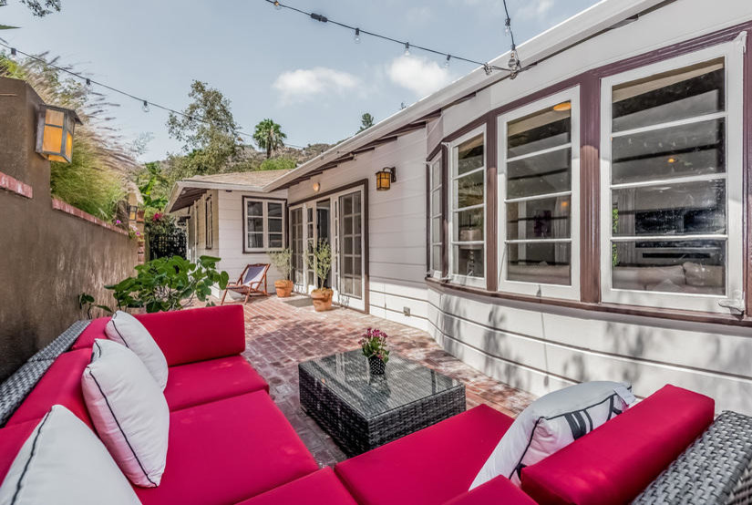 This is an example of a mid-sized contemporary backyard patio in Los Angeles with an awning.