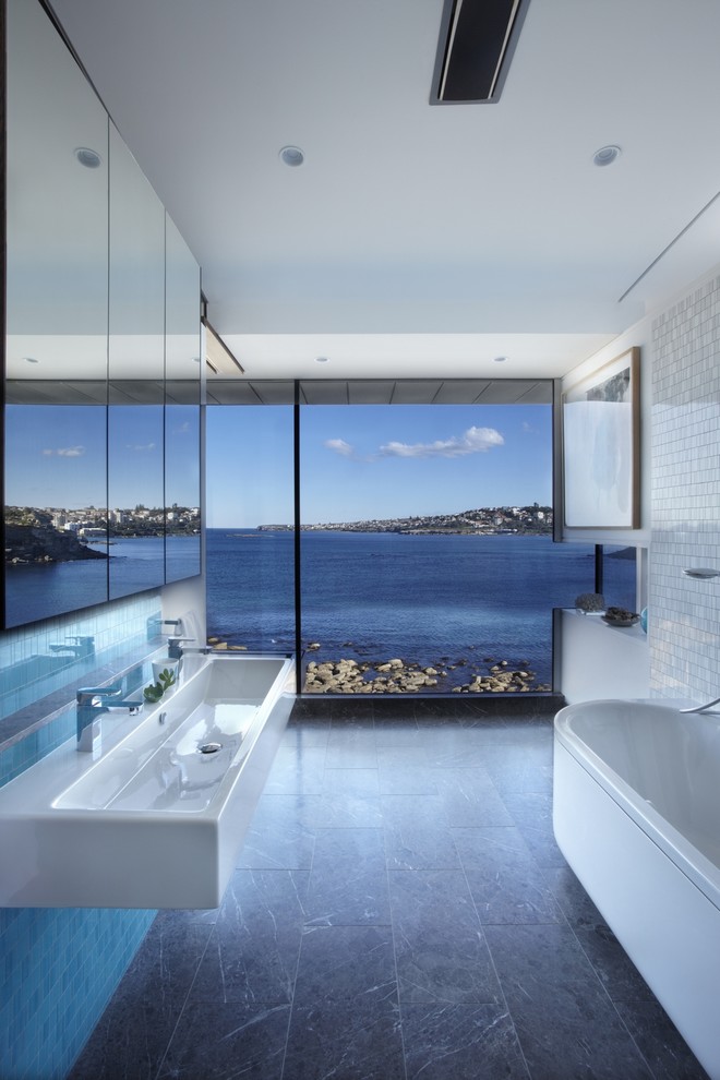 Design ideas for a contemporary bathroom in Sydney with a freestanding tub, white tile, mosaic tile, white walls and a trough sink.