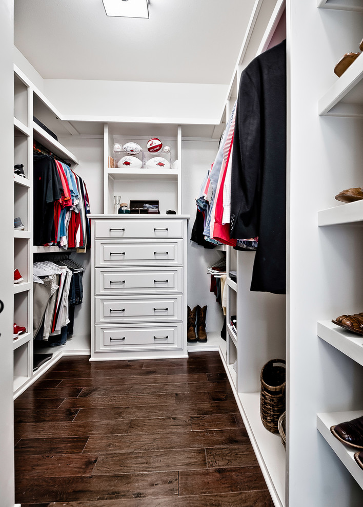 Mid-sized traditional men's walk-in wardrobe in Other with recessed-panel cabinets, white cabinets, dark hardwood floors and brown floor.