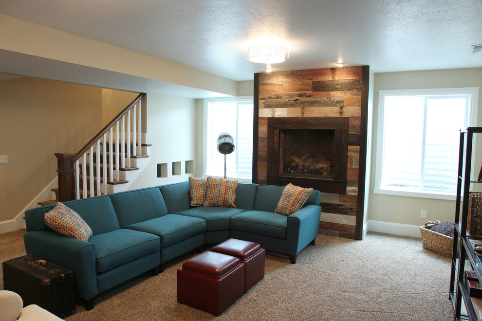Photo of a mid-sized traditional look-out basement in Salt Lake City with beige walls, carpet and a standard fireplace.