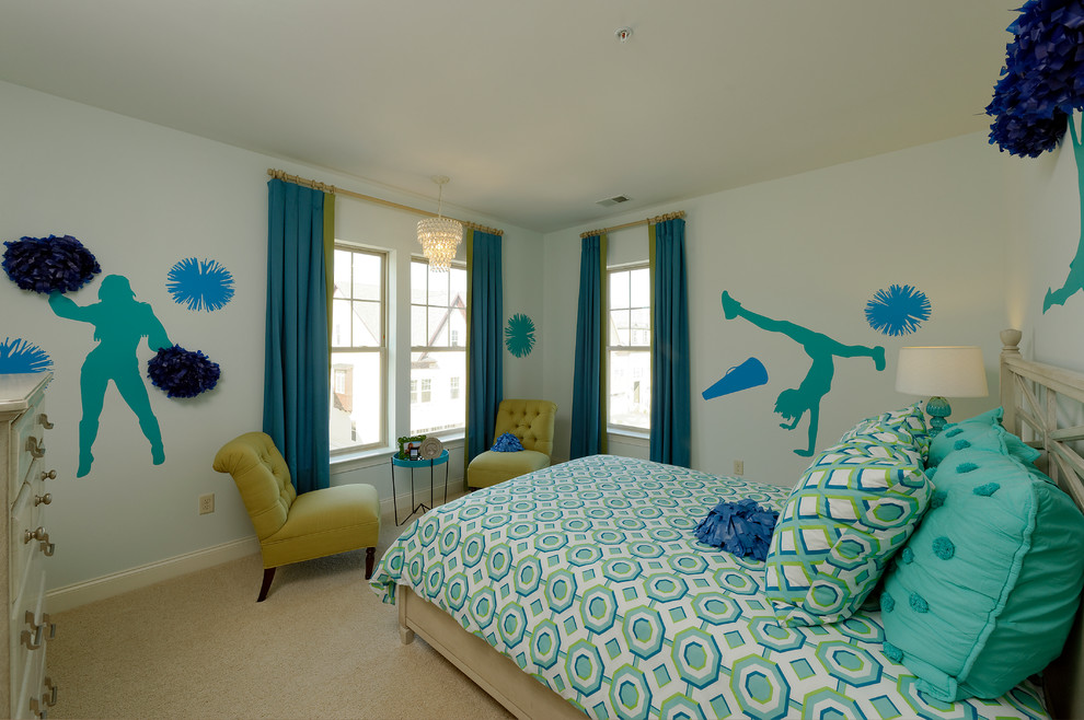 Inspiration for a large transitional kids' room for girls in DC Metro with blue walls and carpet.