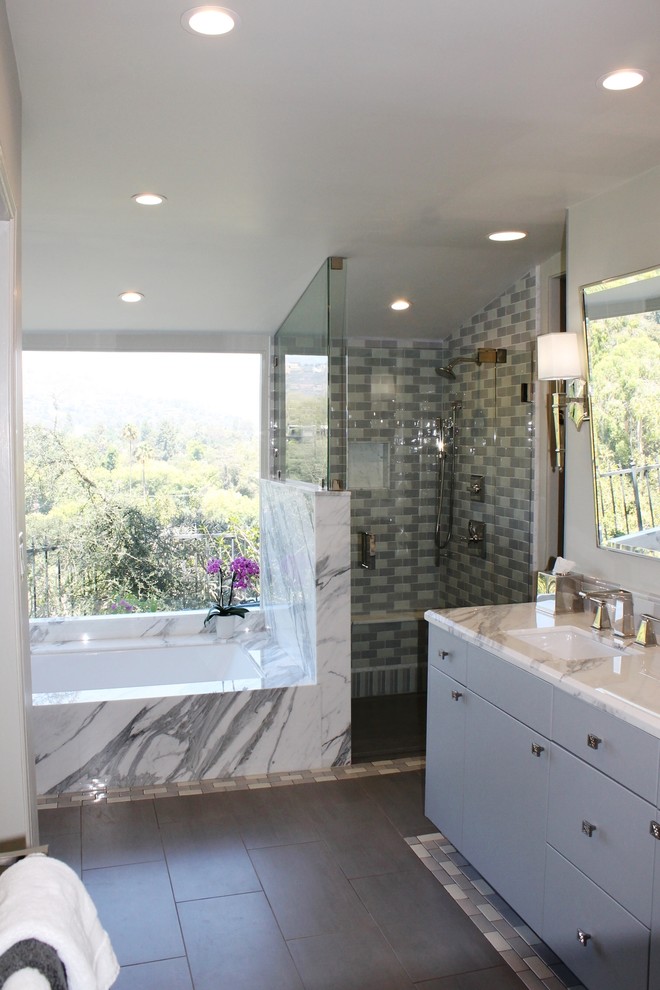 Inspiration for a large transitional master gray tile and ceramic tile porcelain tile walk-in shower remodel in Los Angeles with flat-panel cabinets, gray cabinets, an undermount tub, a two-piece toilet, green walls, an undermount sink and marble countertops