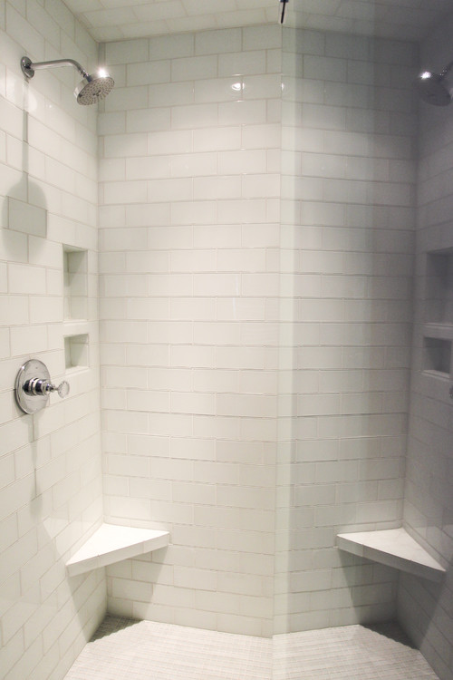 What is the height of the ledge at the corner of the shower area?