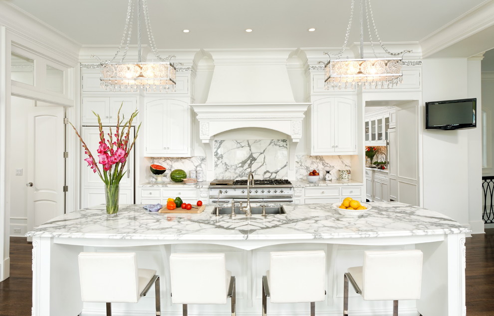Inspiration for a traditional galley kitchen in DC Metro with marble benchtops, a single-bowl sink, beaded inset cabinets, white cabinets, white splashback, stone slab splashback and panelled appliances.