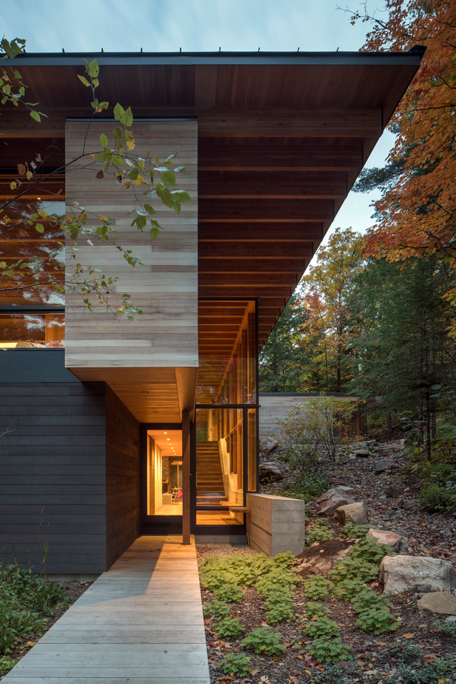 Inspiration for a mid-sized modern front door in Seattle with light hardwood floors, a single front door and a gray front door.