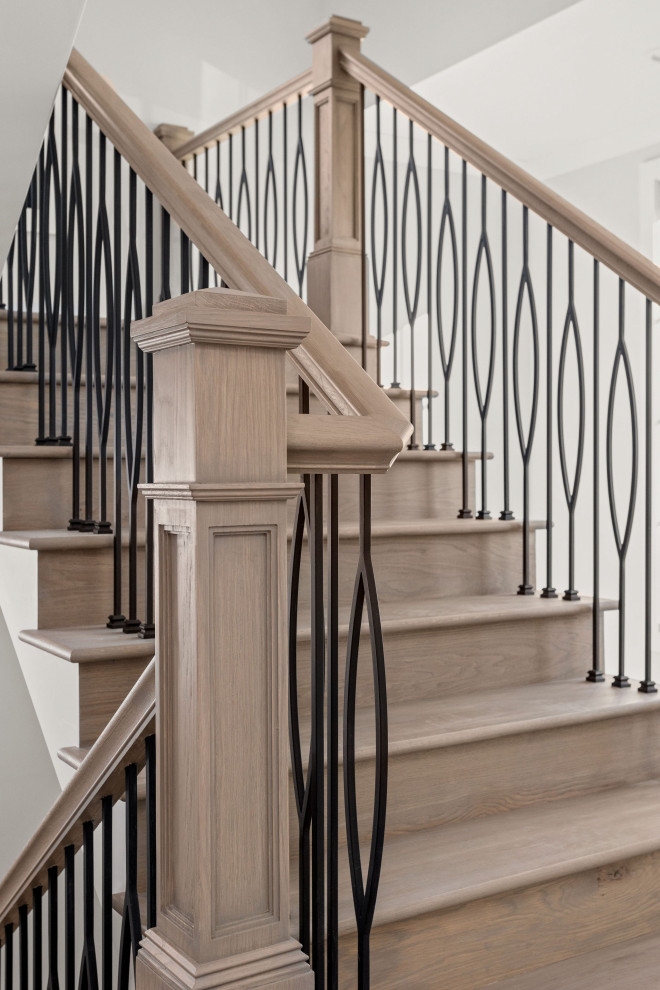 Staircase - large modern wooden u-shaped wood railing staircase idea in Indianapolis with wooden risers