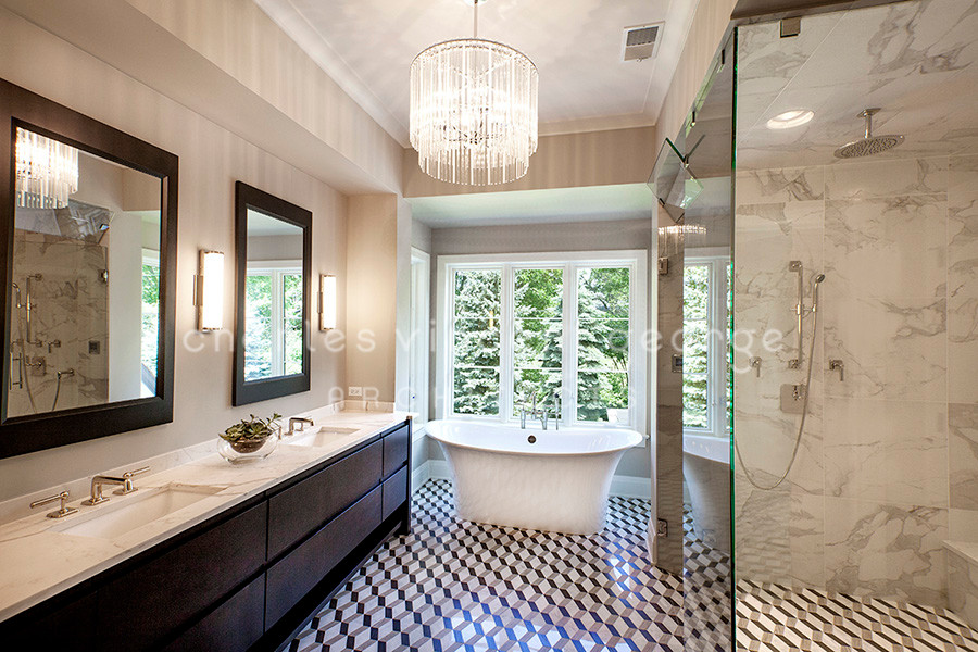 Photo of a large transitional master bathroom in Chicago with dark wood cabinets, a freestanding tub, an open shower, white tile, marble, mosaic tile floors, an undermount sink, marble benchtops, grey floor and a hinged shower door.