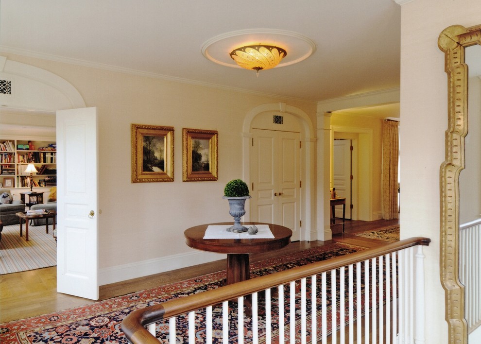 Inspiration for a large traditional foyer in Boston with medium hardwood floors.
