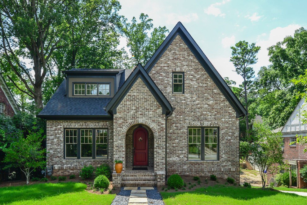 Design ideas for a large traditional two-storey brick brown house exterior in Atlanta with a shingle roof and a gable roof.