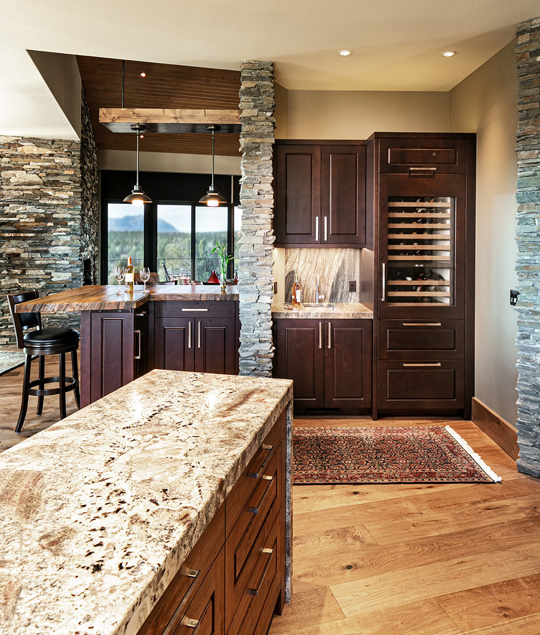 Example of a large transitional u-shaped open concept kitchen design with raised-panel cabinets, dark wood cabinets, granite countertops, an island and multicolored countertops