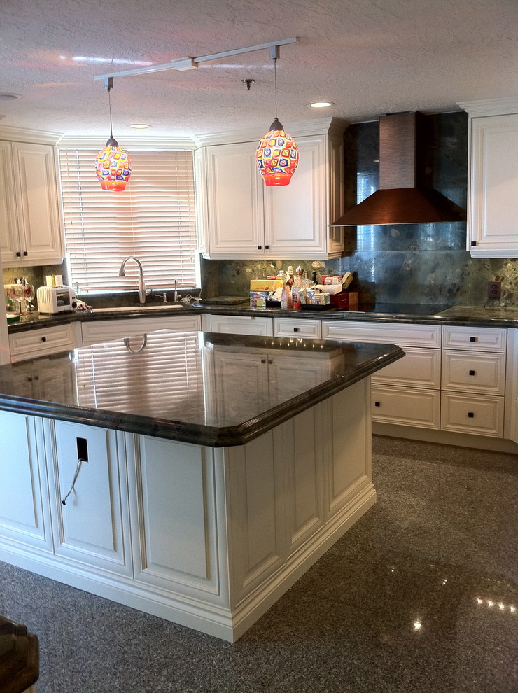 Large transitional u-shaped terrazzo floor and black floor open concept kitchen photo in Miami with a single-bowl sink, raised-panel cabinets, white cabinets, granite countertops, multicolored backsplash, stone tile backsplash, stainless steel appliances and an island