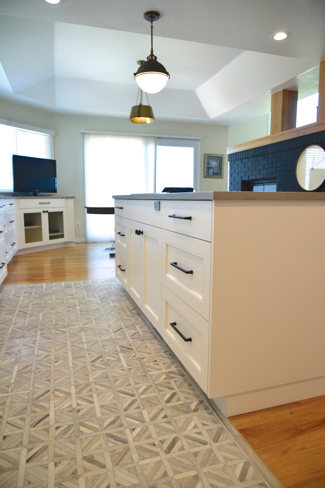 Eat-in kitchen - mid-sized transitional single-wall porcelain tile, beige floor and coffered ceiling eat-in kitchen idea in Denver with an undermount sink, shaker cabinets, beige cabinets, quartz countertops, beige backsplash, cement tile backsplash, stainless steel appliances, an island and beige countertops