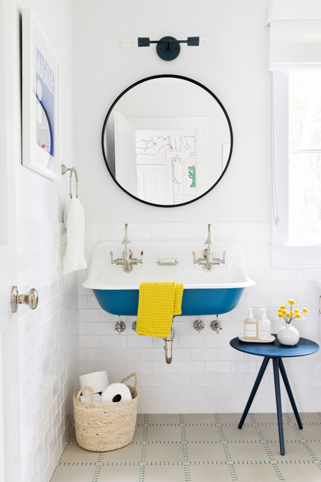 Photo of a mid-sized contemporary kids bathroom in New York with a one-piece toilet, white tile, ceramic tile, white walls, cement tiles, a trough sink and beige floor.