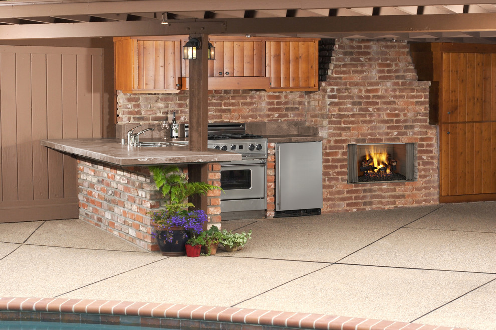 Design ideas for a mid-sized backyard patio in Boston with a fire feature, natural stone pavers and a roof extension.