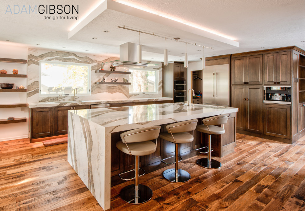 Design ideas for a large modern kitchen in Indianapolis with an undermount sink, brown cabinets, quartz benchtops, multi-coloured splashback, window splashback, stainless steel appliances, medium hardwood floors, with island, brown floor and multi-coloured benchtop.