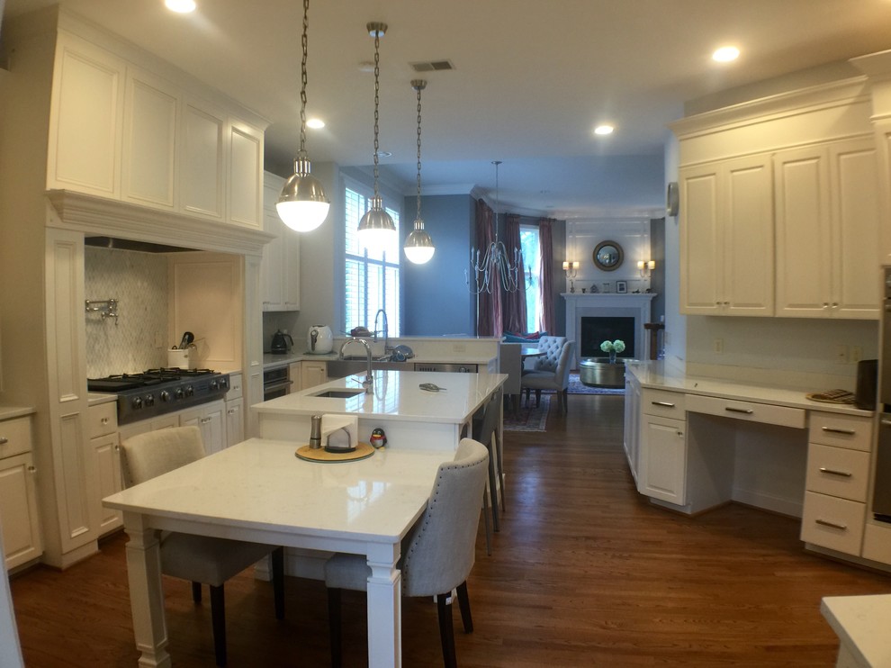 Large transitional u-shaped medium tone wood floor open concept kitchen photo in DC Metro with an undermount sink, raised-panel cabinets, white cabinets, quartzite countertops, stainless steel appliances and an island