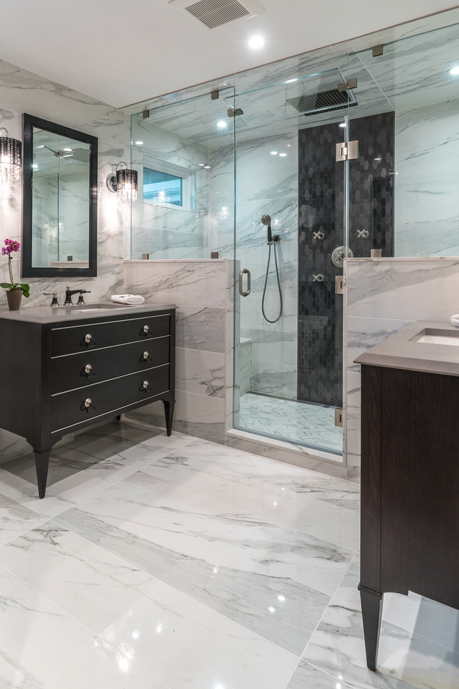 Design ideas for a mid-sized transitional master bathroom in DC Metro with flat-panel cabinets, black cabinets, a double shower, a one-piece toilet, white tile, ceramic tile, white walls, an integrated sink, granite benchtops, grey floor and a hinged shower door.
