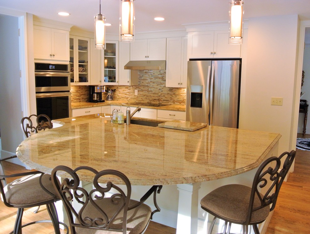 Transitional light wood floor kitchen photo in Boston with an undermount sink, shaker cabinets, white cabinets, granite countertops, stainless steel appliances and an island