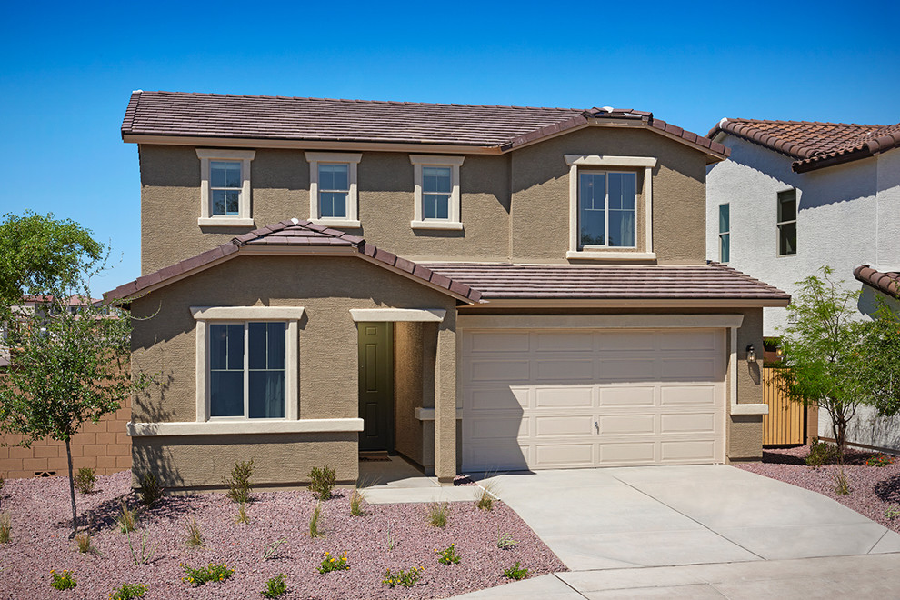 Photo of a contemporary two-storey stucco beige house exterior in Denver.