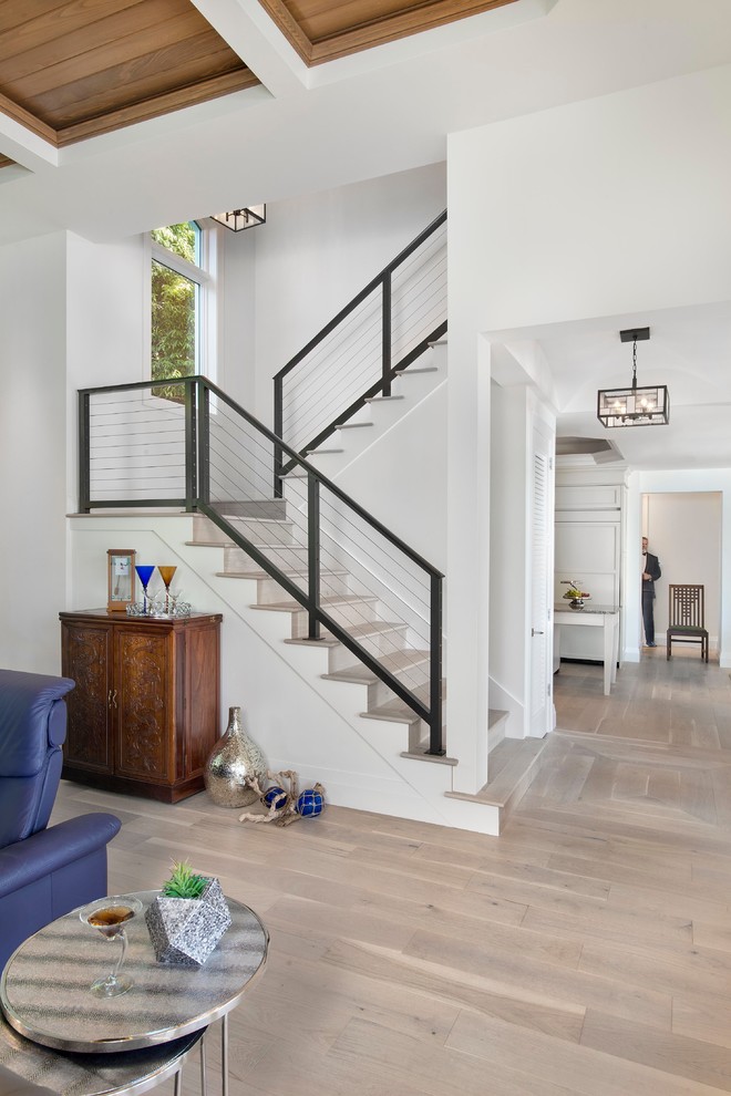 Inspiration for a mid-sized transitional wood straight staircase in Miami with wood risers.