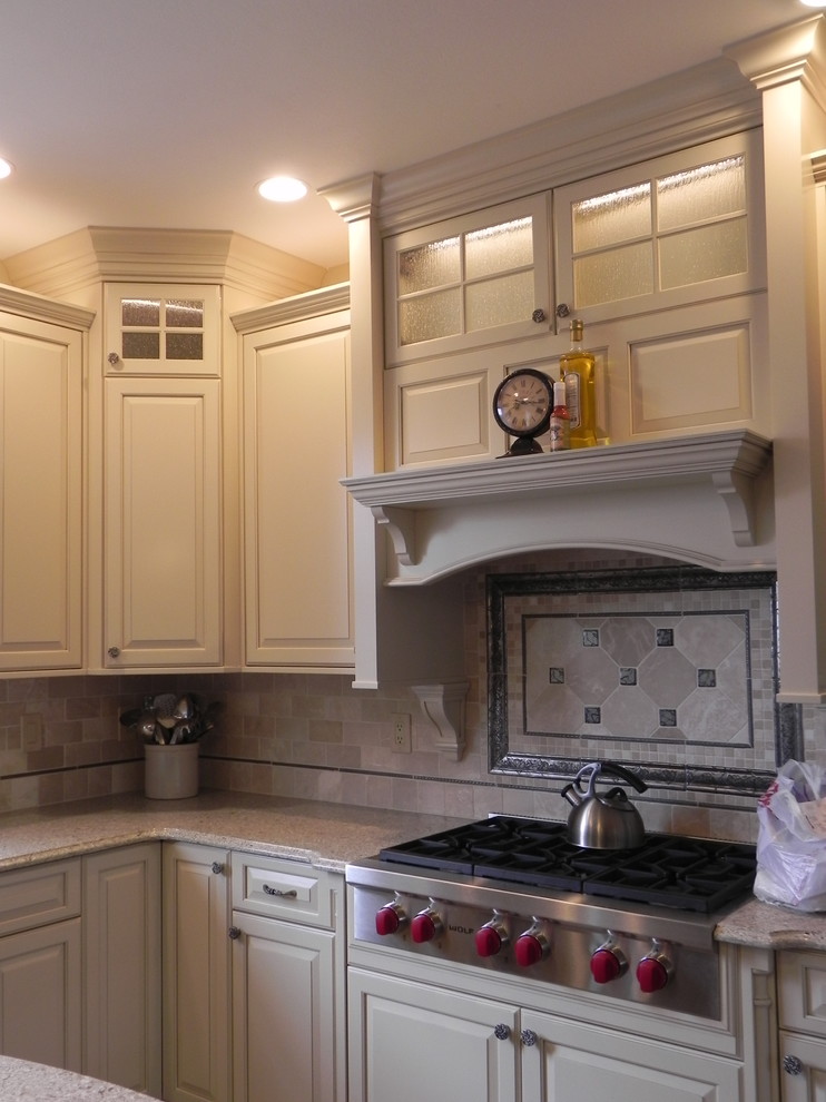 Mid-sized transitional kitchen photo with raised-panel cabinets, white cabinets, beige backsplash, subway tile backsplash and stainless steel appliances