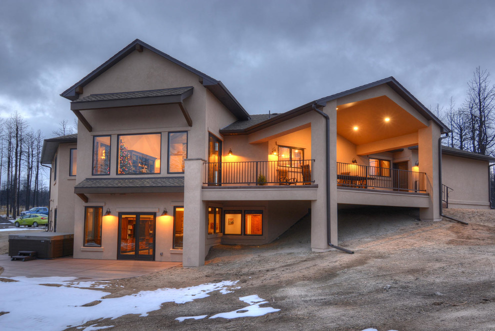 Example of a transitional home design design in Denver