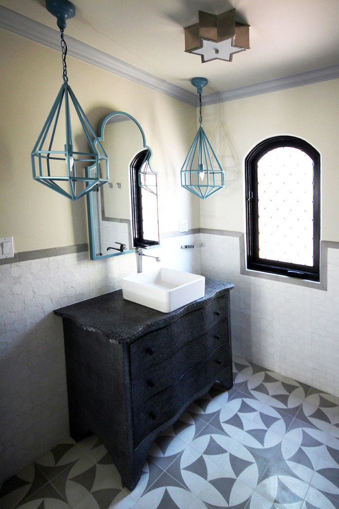 Inspiration for a small mediterranean 3/4 bathroom in San Diego with a vessel sink, furniture-like cabinets, grey cabinets, zinc benchtops, a drop-in tub, a shower/bathtub combo, white tile, ceramic tile, beige walls and ceramic floors.