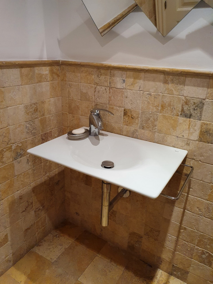 This is an example of a mid-sized contemporary kids bathroom in London with a one-piece toilet, beige tile, travertine, beige walls, limestone floors, an undermount sink, beige floor, white benchtops, a single vanity, a freestanding vanity and coffered.
