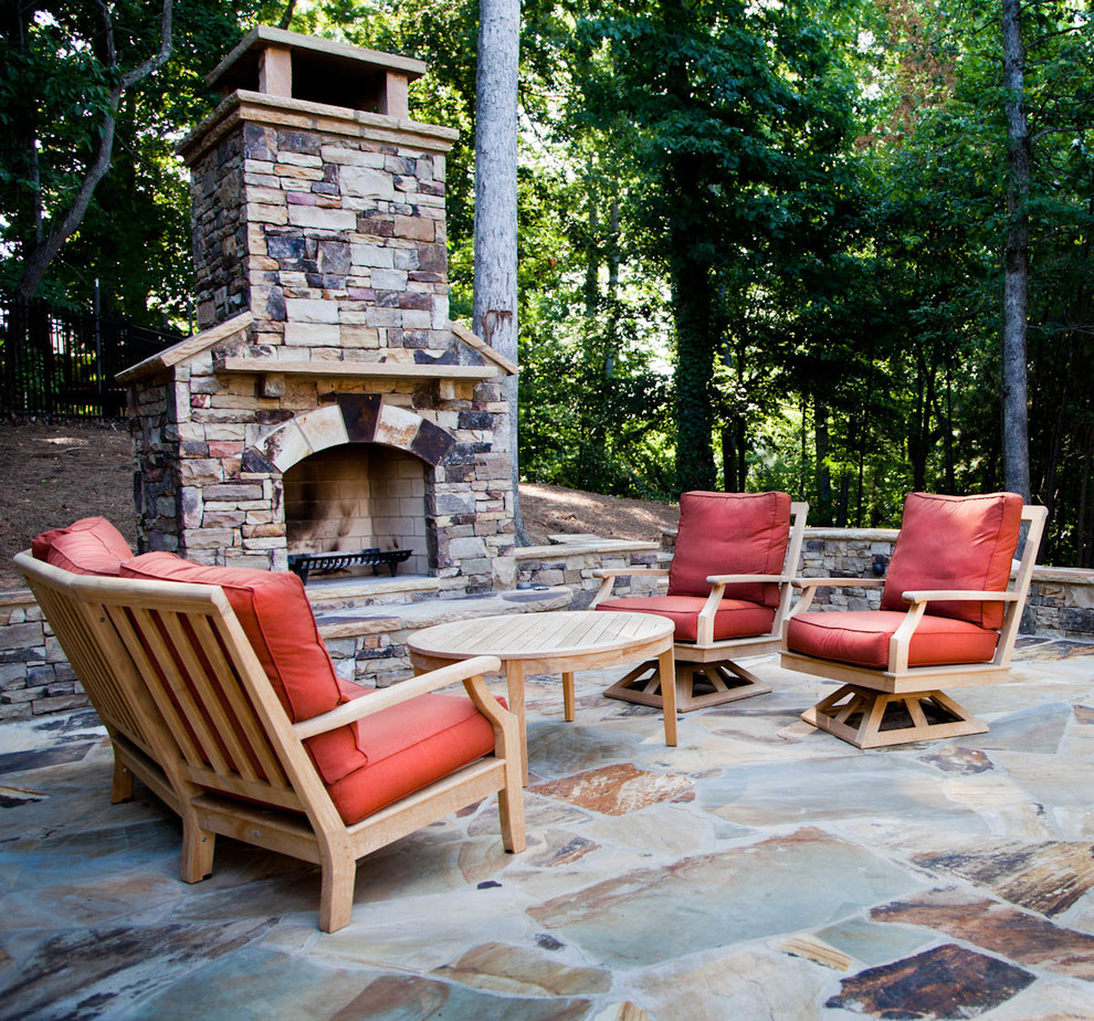 Inspiration for a mid-sized traditional backyard patio in Atlanta with a fire feature, no cover and natural stone pavers.