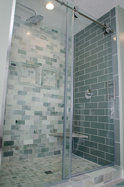 Photo of a mid-sized transitional master bathroom in Indianapolis with an alcove shower, beige tile, gray tile, green tile, subway tile, grey walls and ceramic floors.