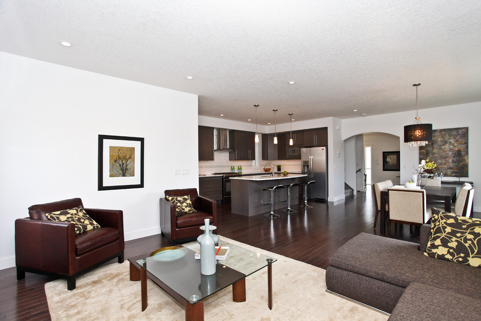 Mid-sized modern open concept living room in Calgary with a home bar, white walls, dark hardwood floors, a standard fireplace, a tile fireplace surround and no tv.