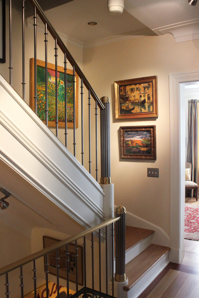 Inspiration for a mid-sized traditional wood straight staircase in DC Metro with wood risers.