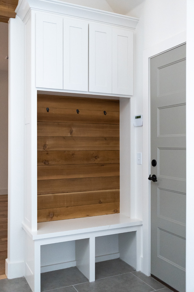 Inspiration for a small transitional mudroom in Oklahoma City with white walls, ceramic floors, a single front door, a gray front door and grey floor.