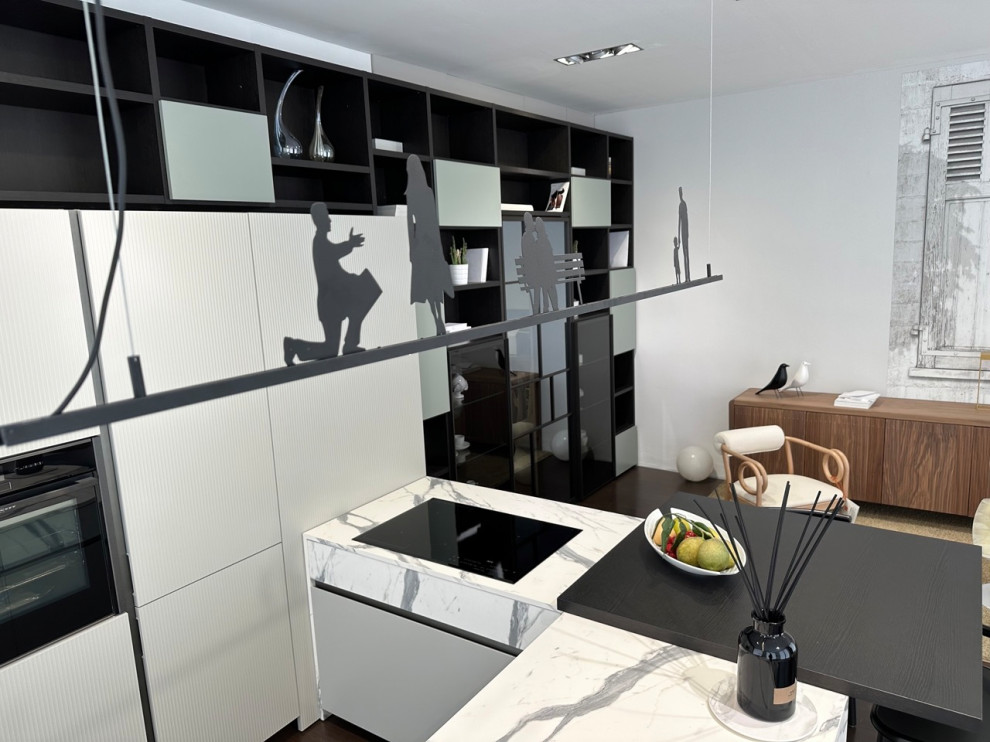 Inspiration for a large contemporary u-shaped open plan kitchen in Other with an integrated sink, glass-front cabinets, white cabinets, laminate countertops, black appliances, dark hardwood flooring, brown floors and multicoloured worktops.