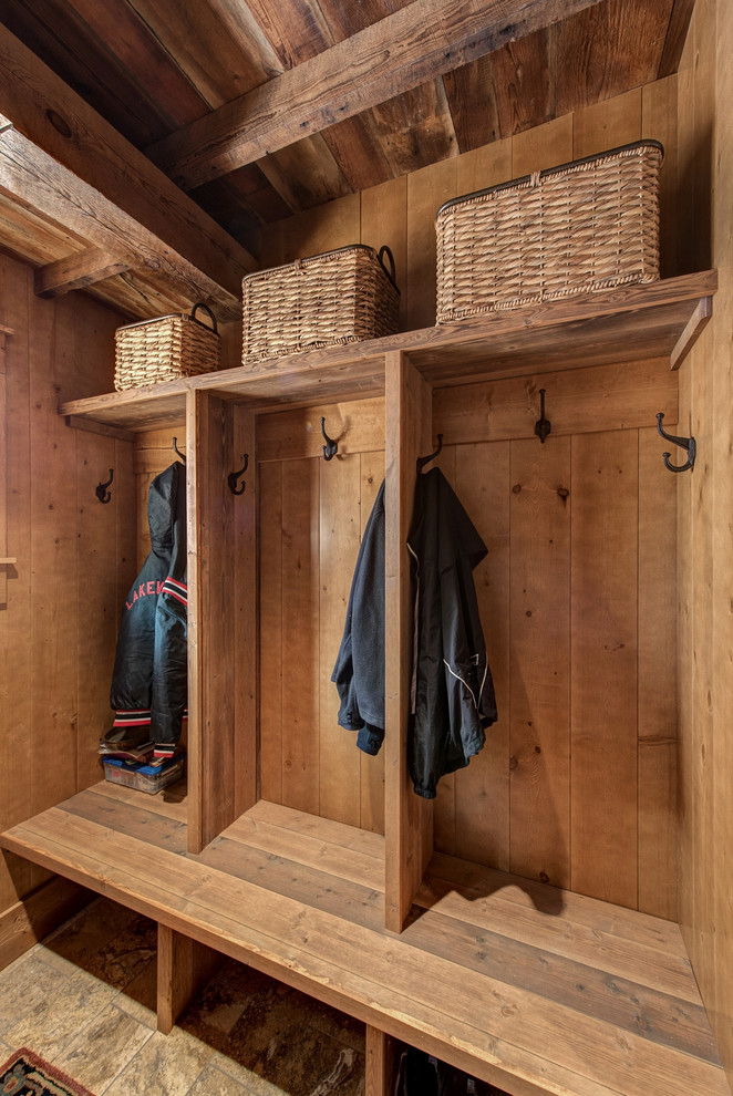 Design ideas for a country mudroom in Minneapolis with brown walls.