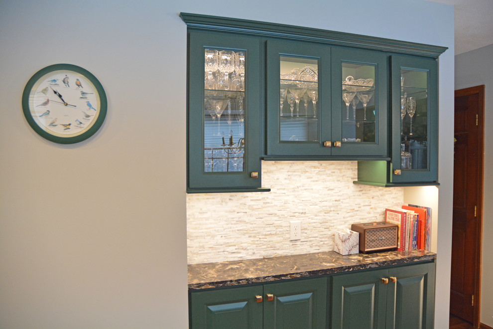 Small transitional l-shaped medium tone wood floor and brown floor eat-in kitchen photo with an undermount sink, raised-panel cabinets, green cabinets, quartz countertops, white backsplash, marble backsplash, black appliances, an island and multicolored countertops