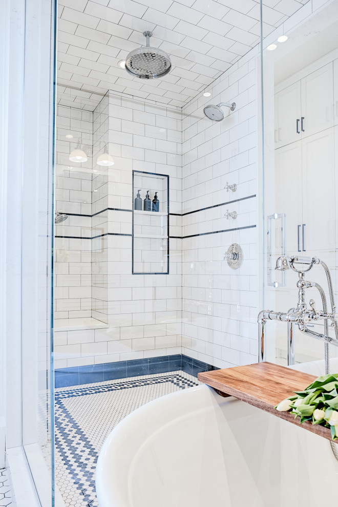 Photo of a mid-sized traditional master bathroom in Detroit with shaker cabinets, white cabinets, a freestanding tub, an alcove shower, a bidet, white tile, subway tile, white walls, ceramic floors, an undermount sink, marble benchtops, white floor, a hinged shower door, white benchtops, an enclosed toilet, a double vanity and a built-in vanity.