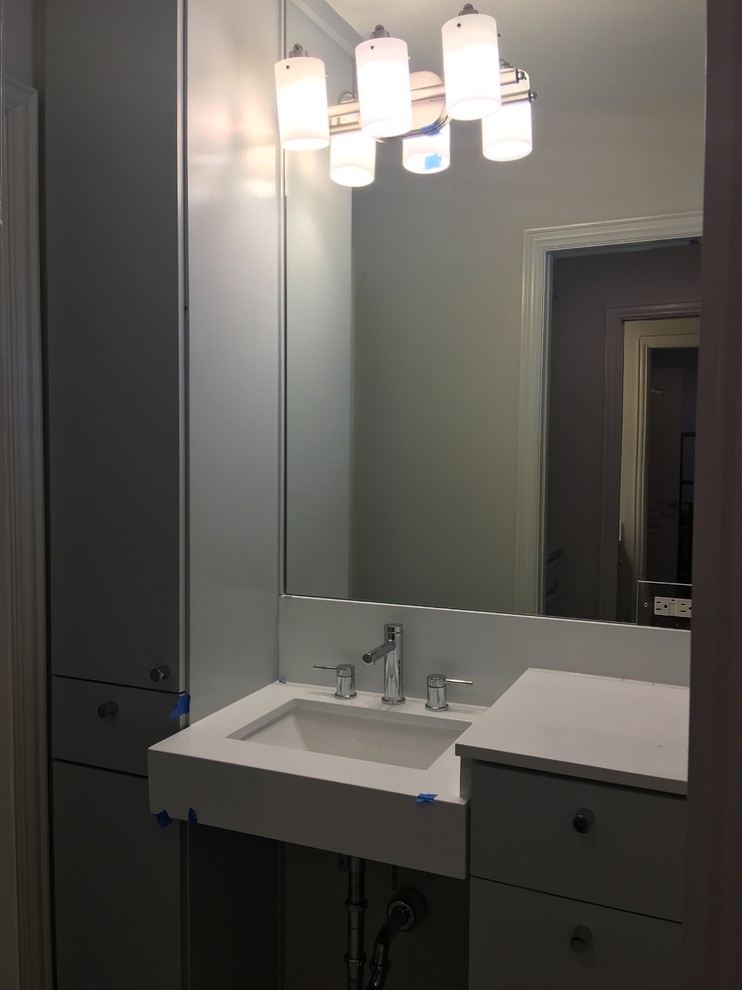 Inspiration for a transitional porcelain tile home design remodel in Dallas with medium tone wood cabinets, an undermount sink and quartz countertops