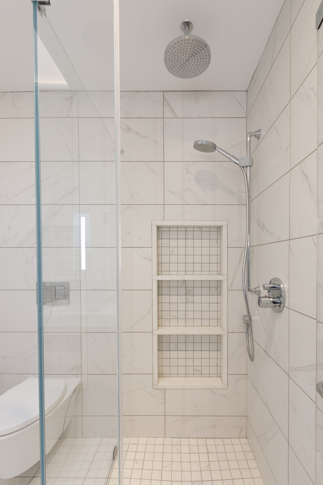 Design ideas for a contemporary master bathroom in Philadelphia with flat-panel cabinets, medium wood cabinets, a one-piece toilet, white tile, marble, white walls, quartzite benchtops, a double shower, marble floors, white floor and a hinged shower door.