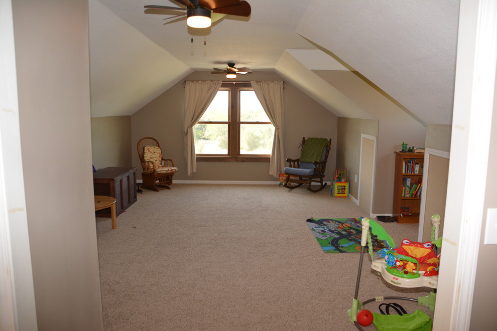 Design ideas for a mid-sized arts and crafts gender-neutral kids' room in Kansas City with beige walls and carpet.