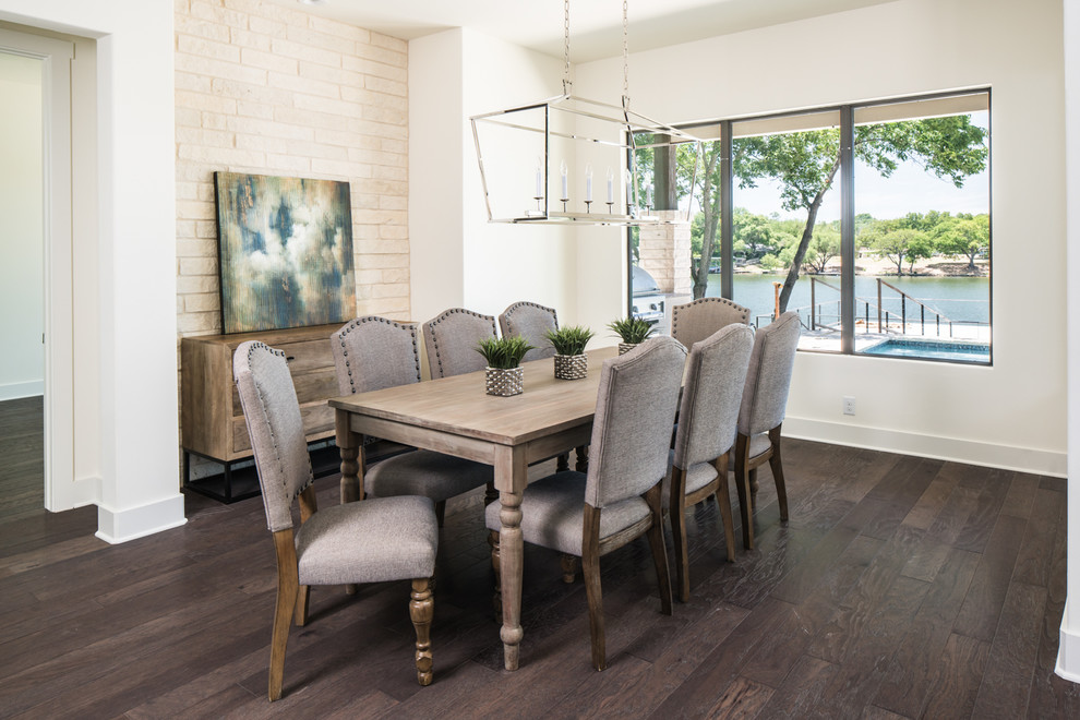 Design ideas for a large transitional separate dining room in Austin with white walls, dark hardwood floors and no fireplace.