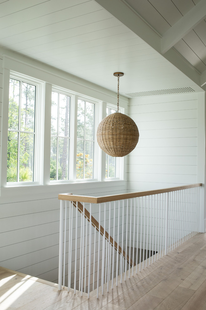Inspiration for a mid-sized country wood floating staircase in Charleston with mixed railing.