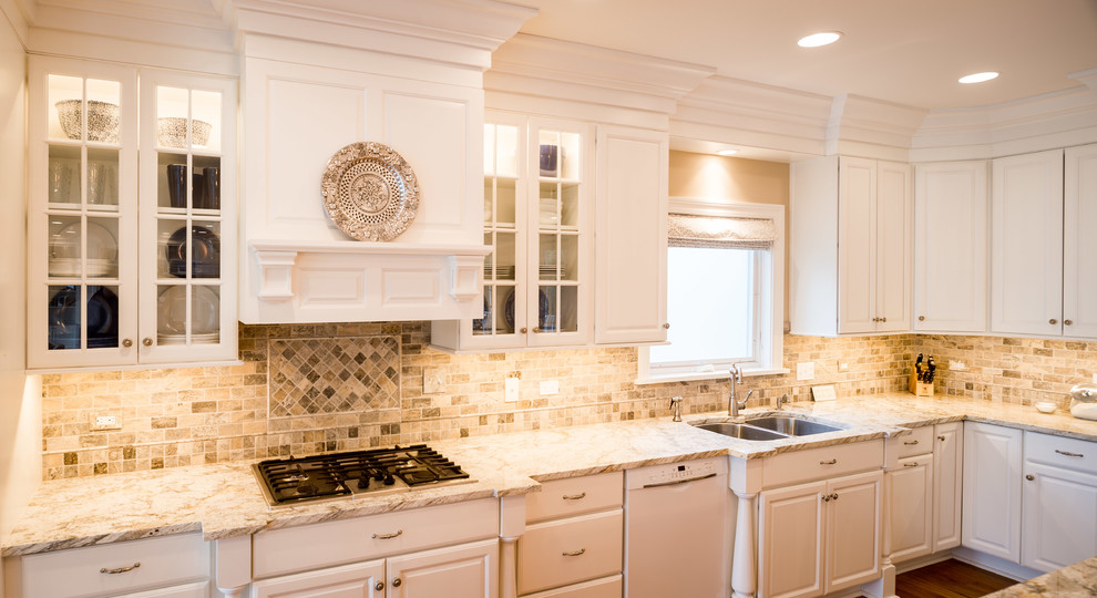 Design ideas for a mid-sized transitional l-shaped open plan kitchen in Chicago with an undermount sink, raised-panel cabinets, white cabinets, granite benchtops, stainless steel appliances, medium hardwood floors, with island and brown floor.