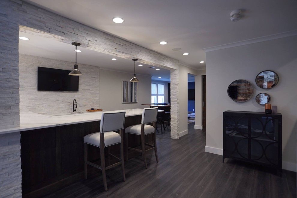 Inspiration for a large industrial walk-out basement in DC Metro with grey walls and vinyl floors.