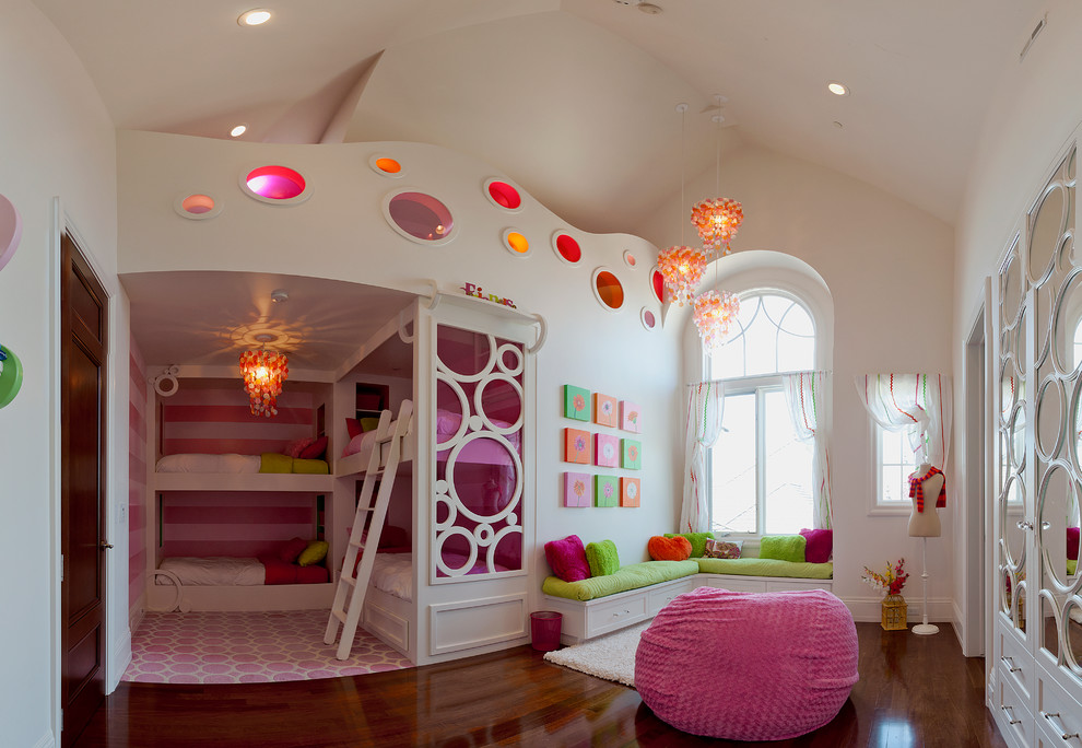 Design ideas for a large transitional kids' room for girls and kids 4-10 years old in Salt Lake City with white walls, dark hardwood floors and brown floor.
