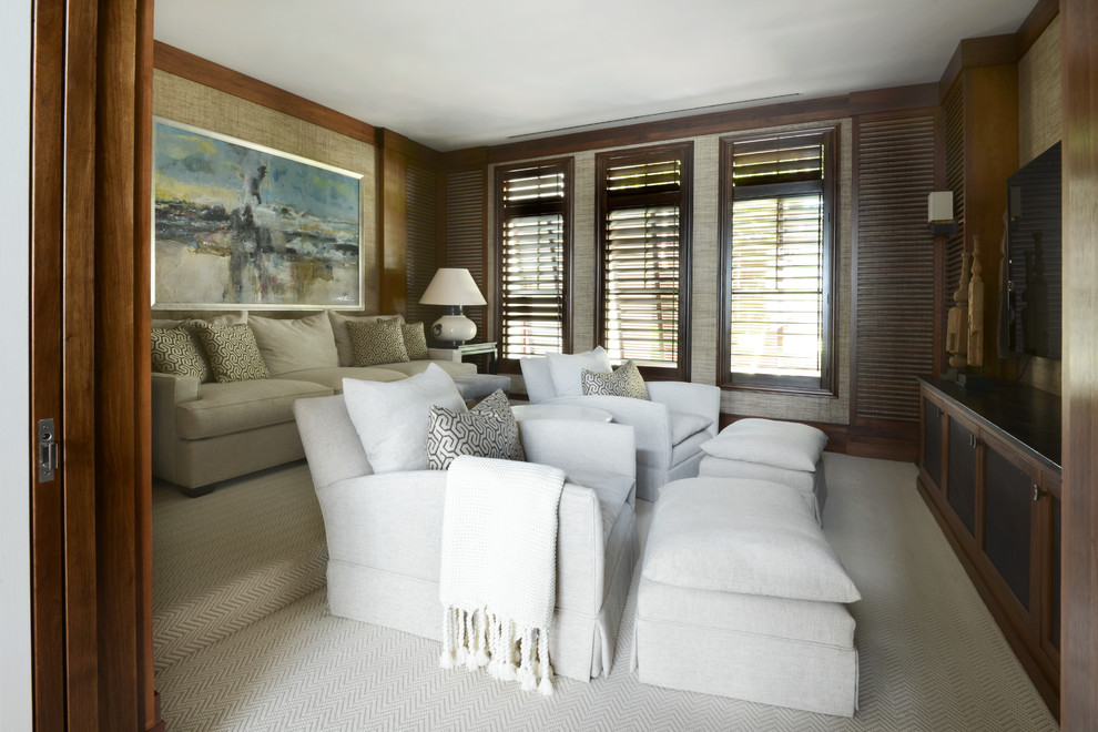 Home theater - huge contemporary enclosed carpeted home theater idea in Tampa with brown walls and a media wall