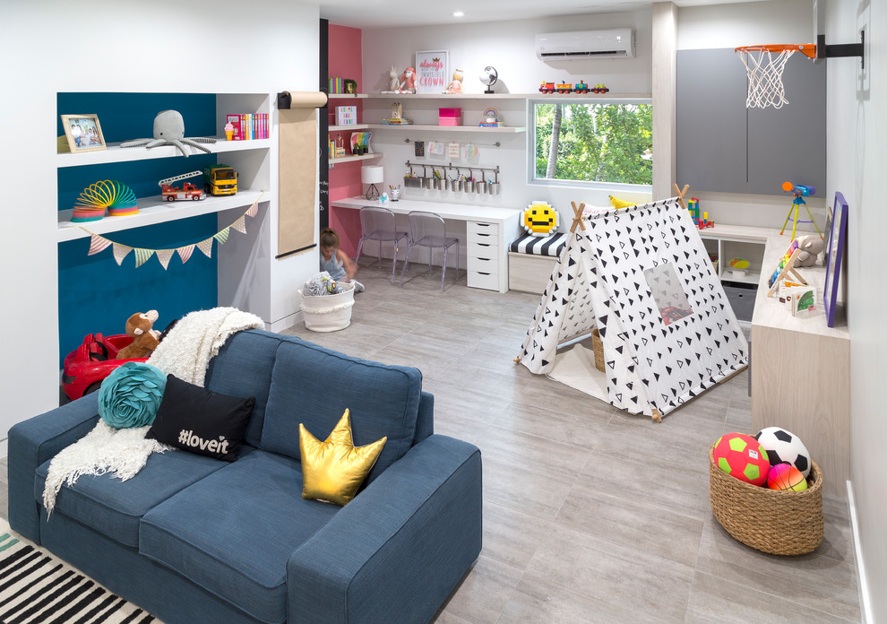 Large contemporary gender-neutral kids' playroom in Miami with white walls, porcelain floors and grey floor for kids 4-10 years old.