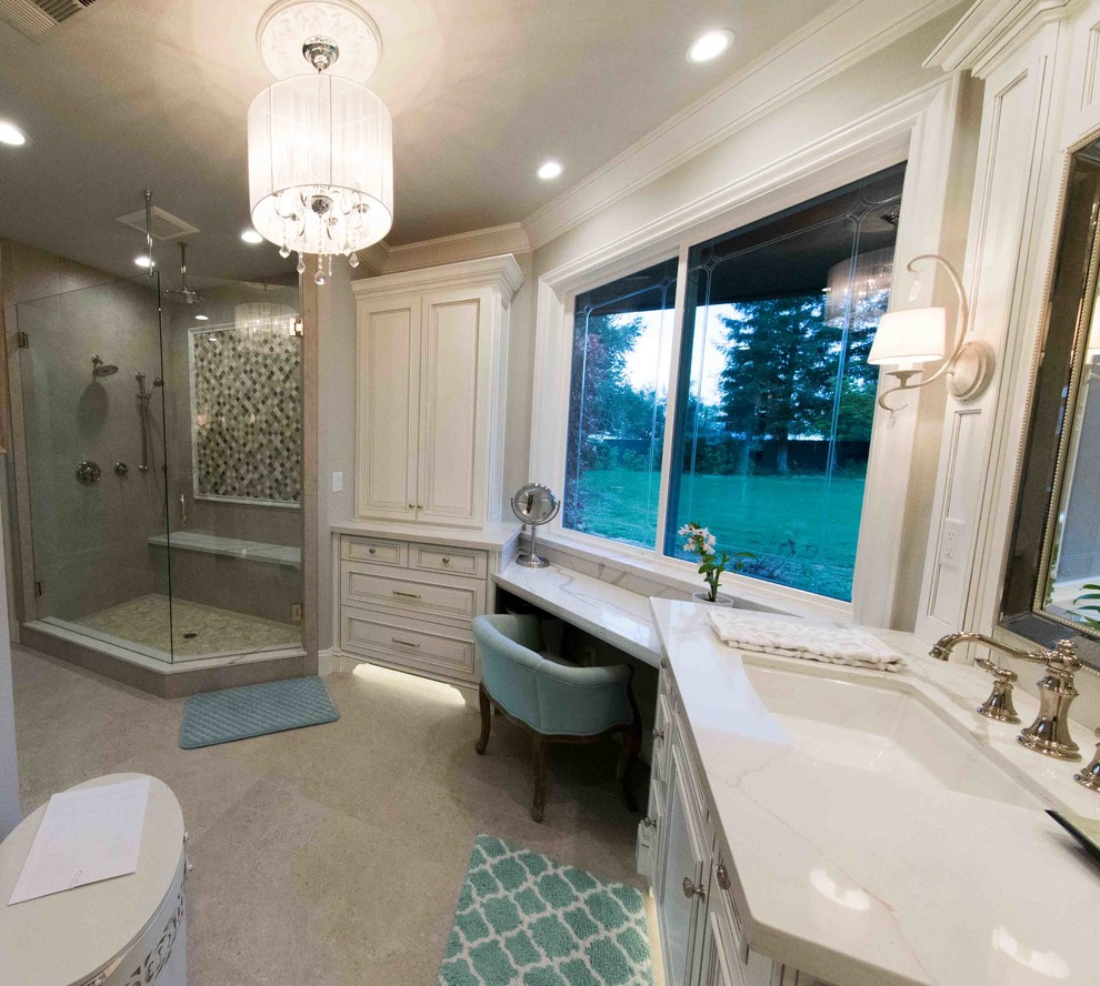 Large transitional master bathroom in Other with raised-panel cabinets, white cabinets, a double shower, a one-piece toilet, beige tile, grey walls, an undermount sink, marble benchtops, a hinged shower door and white benchtops.
